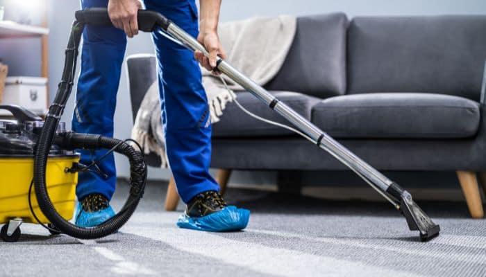 Should I hire a professional carpet cleaner instead of using washing powder?